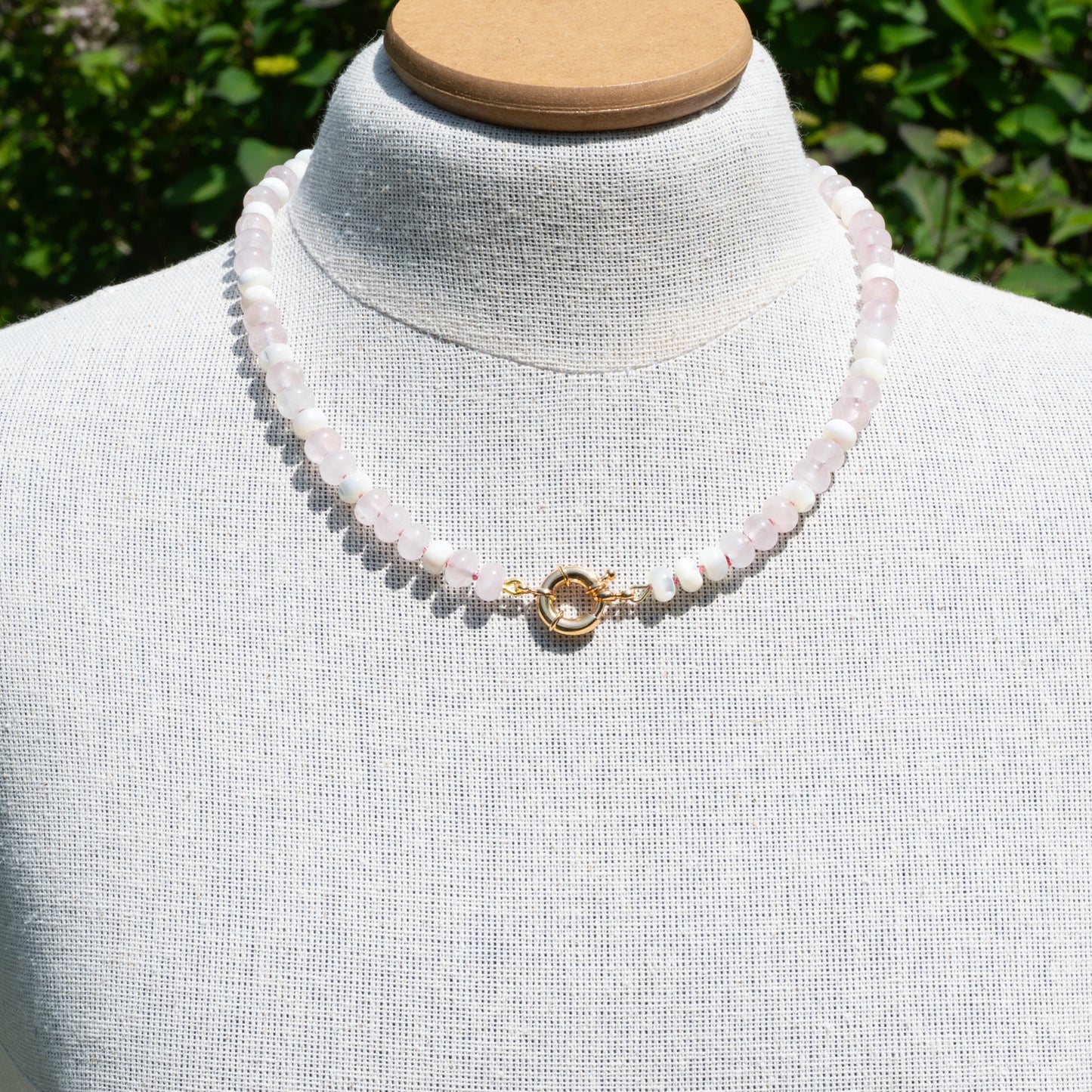 Rose Quartz and mother of pearl hand knotted necklace finished with a gold filled clasp.