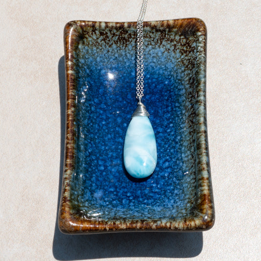 Handmade wire wrapped sterling silver Larimar pendant. Beautiful Caribbean shades of blue. Each pendant is one of a kind. Choose chain or charm only.
