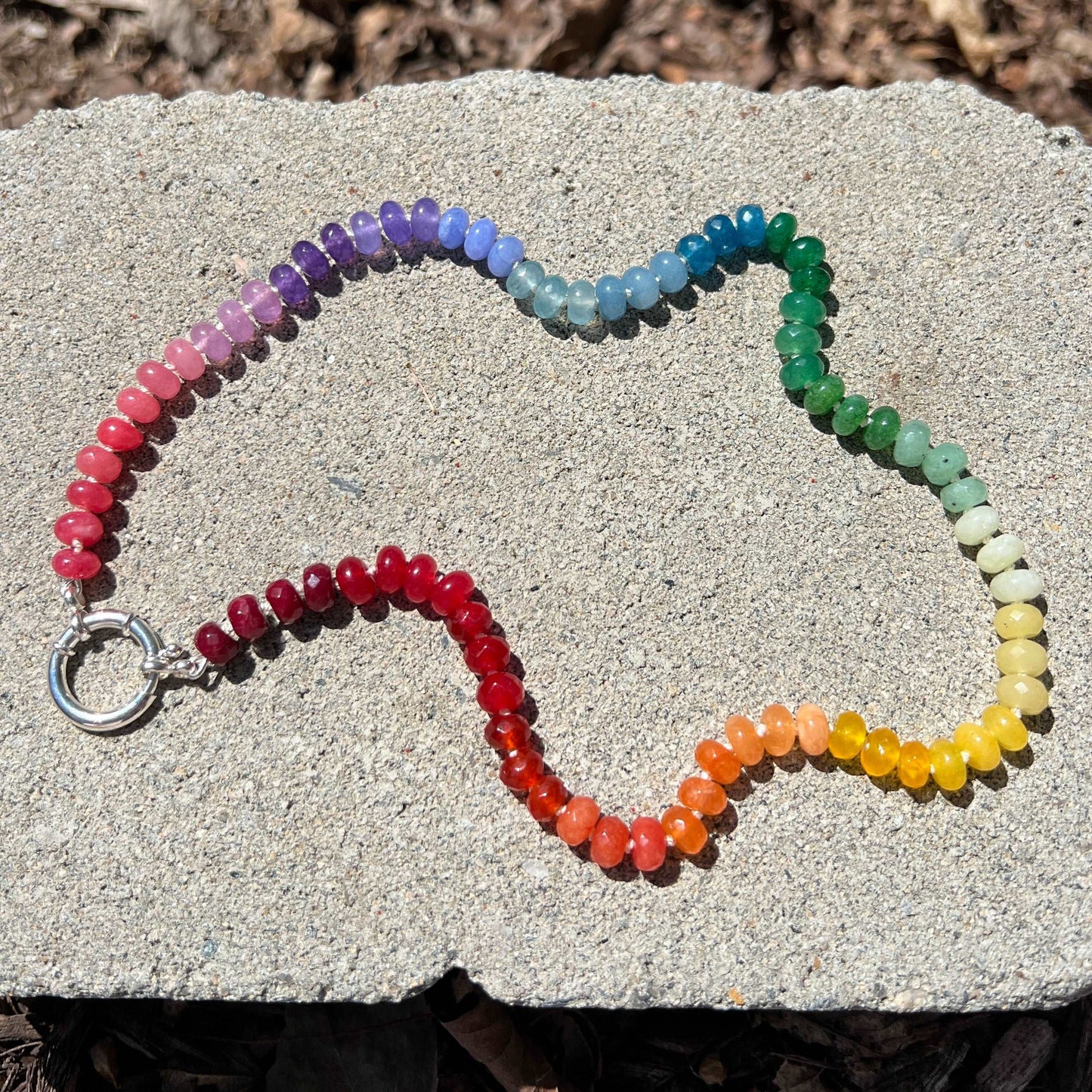 Gay Pride Hand Knotted Rainbow necklace using 8mm dyed jade beads at 21 inches long. Finished with a sterling silver clasp.