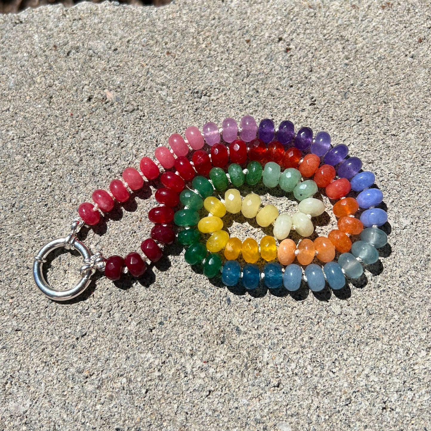 Gay Pride Hand Knotted Rainbow necklace using 8mm dyed jade beads at 21 inches long. Finished with a sterling silver clasp.