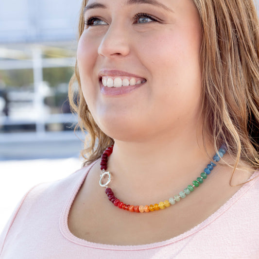 Hand Knotted Rainbow necklace using 8mm dyed jade beads at 21 inches long. Finished with a sterling silver clasp.