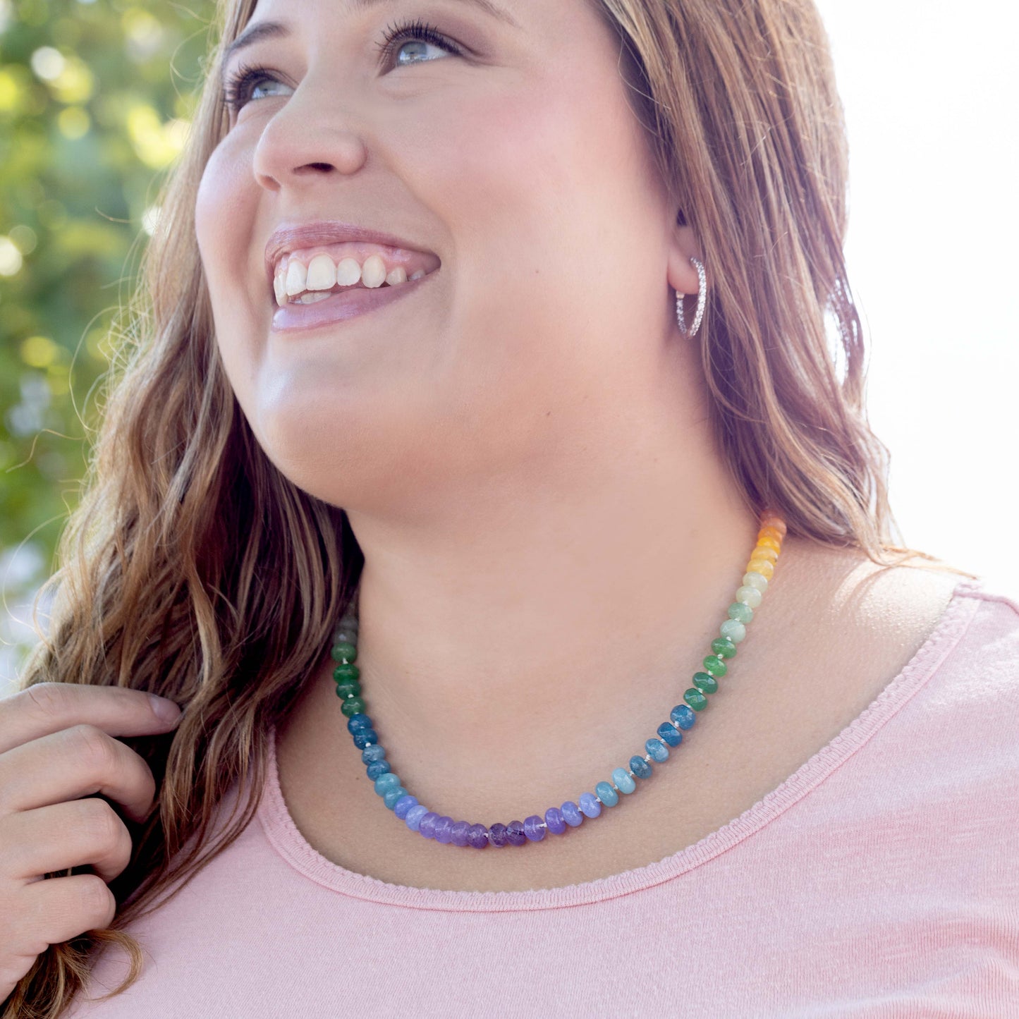 Hand Knotted Rainbow necklace using 8mm dyed jade beads at 21 inches long. Finished with a sterling silver clasp.