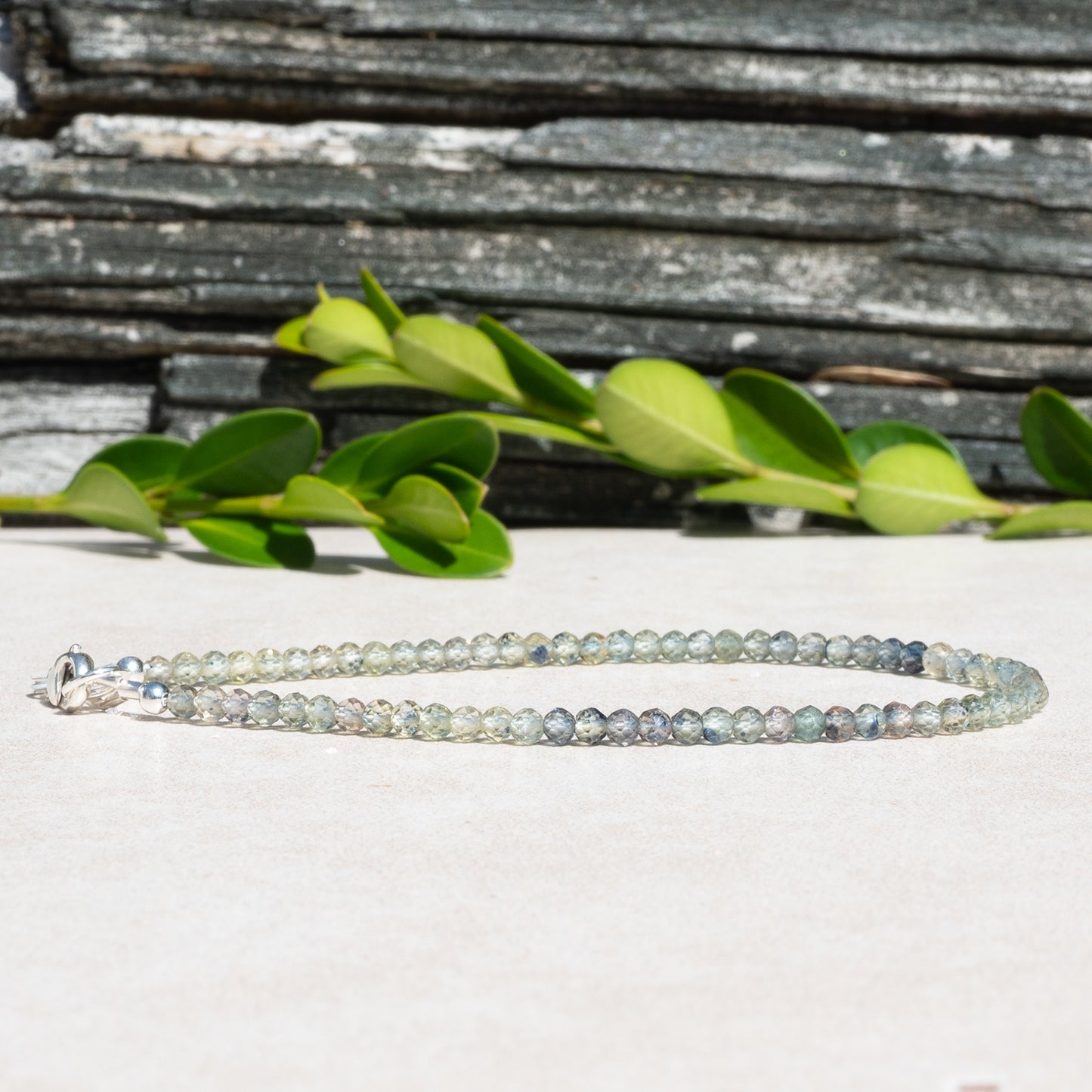Green Sapphire beaded gemstone bracelet with shades of blues and greens.