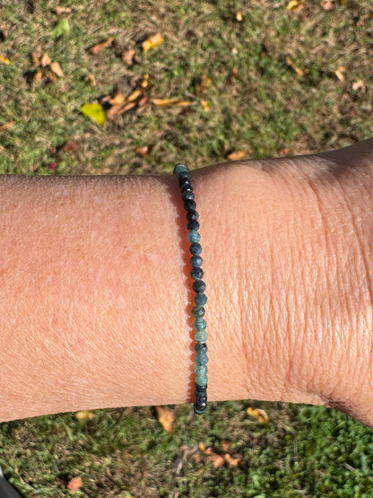 Shaded blue tourmaline beaded bracelet on wrist