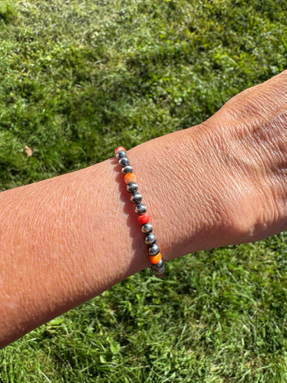 Sterling Silver Navajo Style Pearl and Spiny Oyster Bracelet on a wrist