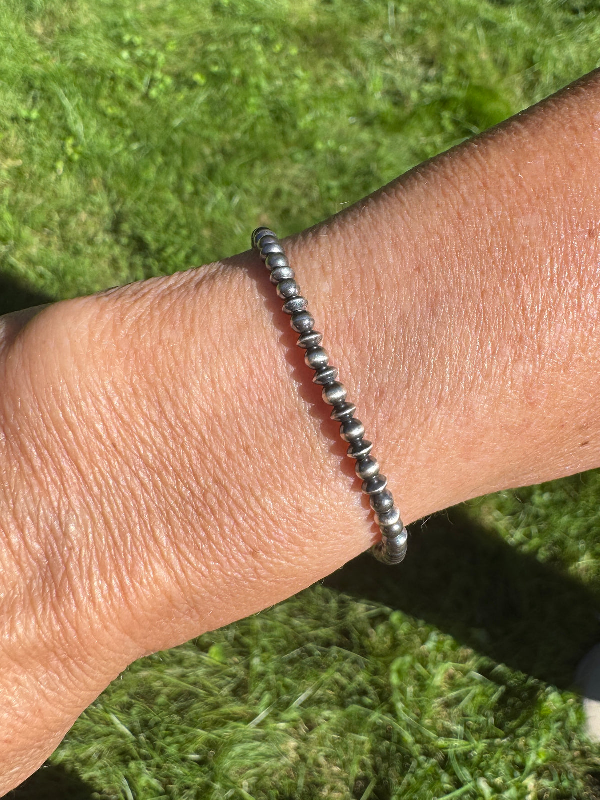 A sterling silver oxidized beaded bracelet. 