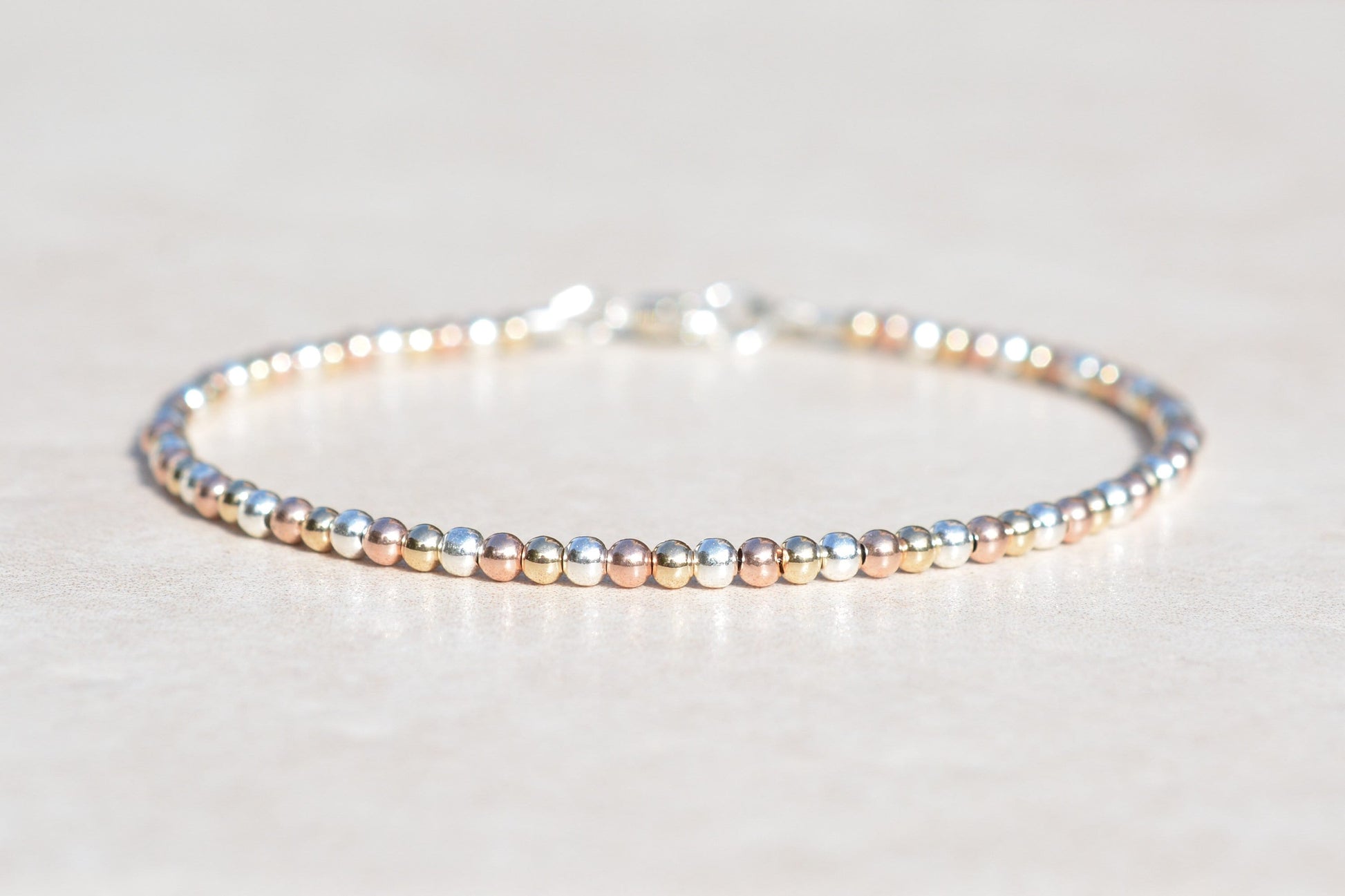 Rose Gold, Yellow Gold, and Sterling Silver Beaded Ball Bracelet Front